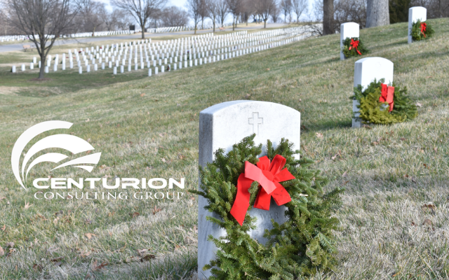 A cemetery with headstones and wreaths on it.